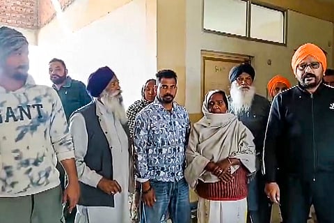 Family members of the victim gather at the institute after a female law student was shot dead by her classmate, in Tarn Taran district, Punjab. A law student on Monday shot dead his classmate inside the classroom before shooting himself. 