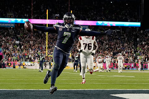 Seattle Seahawks linebacker Uchenna Nwosu (7) celebrates after scoring against the New England Patriots during the second half of the NFL Super Bowl 60 football game in Santa Clara, California.
