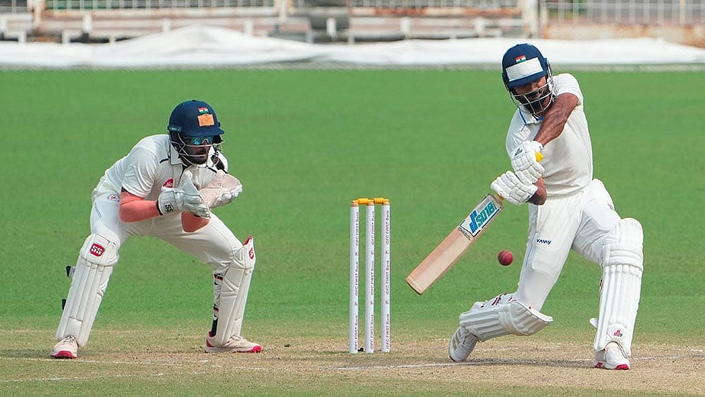 | Photo: PTI/Swapan Mahapatra : Bengal's Akash Deep plays a shot during the fourth day of the Ranji Trophy 2025-26 cricket match between Bengal and Gujarat, at Eden Gardens, in Kolkata.