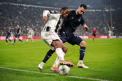 Juventus' Jonathan David, left, and Lazio's Mario Gila in action during the Serie A soccer match between Juventus and Lazio in Turin, Italy.