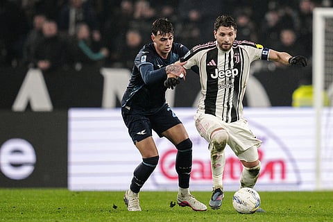 Lazio's Daniel Maldini, left, and Juventus' Manuel Locatelli in action during the Serie A soccer match between Juventus and Lazio in Turin, Italy.