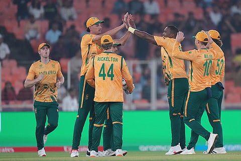 South Africa's Lungi Ngidi, third from right, celebrates with teammates the wicket of Canada's Yuvraj Samra during the T20 World Cup cricket match between Canada and South Africa in Ahmedabad.