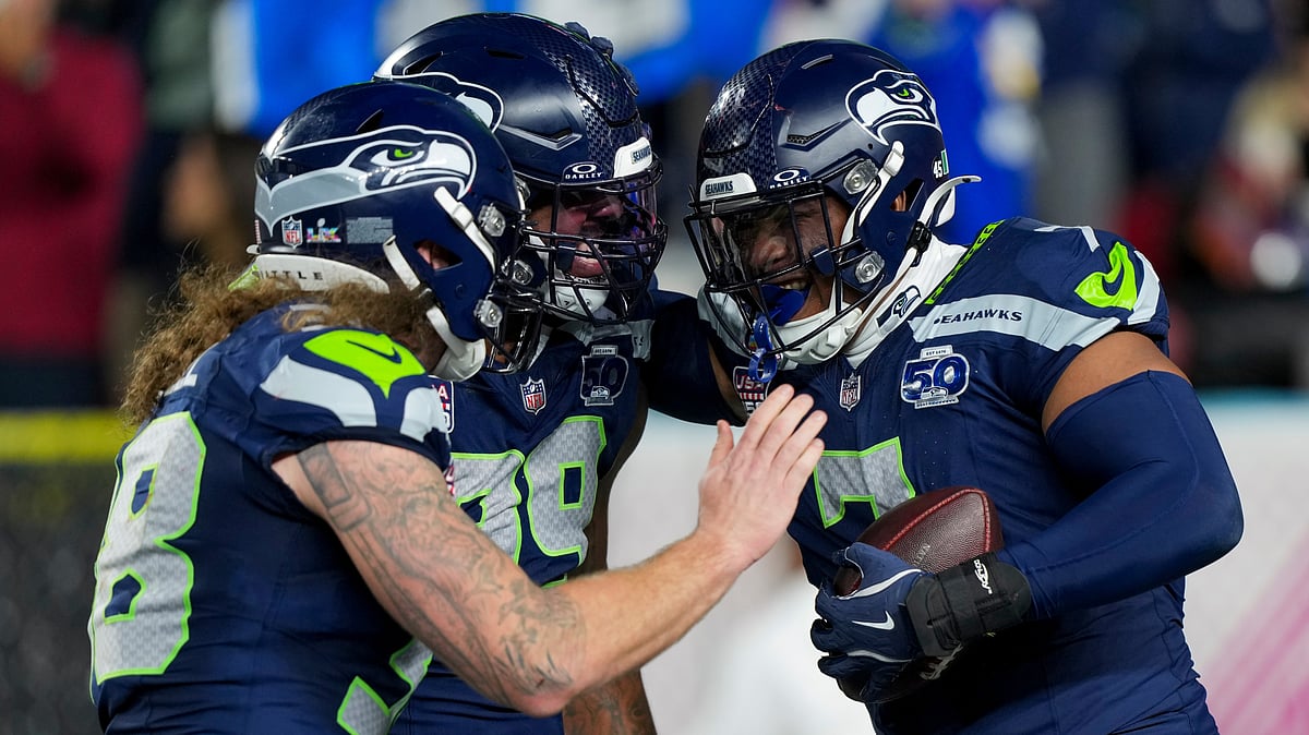 | Photo: AP/Brynn Anderson : Seattle Seahawks linebacker Uchenna Nwosu, right, is congratulated by teammates after recovering a fumble and returning it for a touchdown during the second half of the NFL Super Bowl 60 football game against the New England Patriots, Sunday, Feb. 8, 2026, in Santa Clara, Calif. 