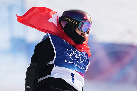 Switzerland's Mathilde Gremaud celebrates her gold medal win in the women's freestyle skiing slopestyle finals at the 2026 Winter Olympics, in Livigno, Italy.