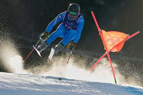 Italy's Mattia Casse speeds down the course during an alpine ski men's downhill portion of a team combined race, at the 2026 Winter Olympics, in Bormio, Italy.