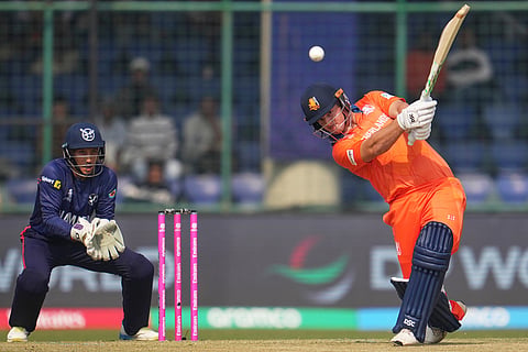 Netherlands' Michael Levitt hits a ball for four runs during the T20 World Cup cricket match between Namibia and Netherlands in New Delhi.
