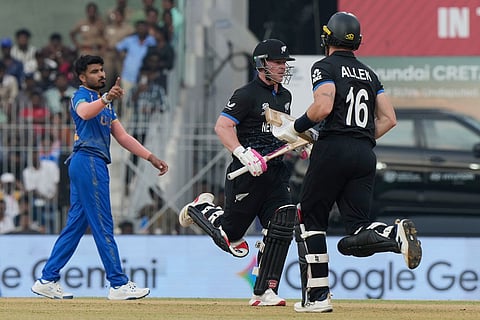 New Zealand's Tim Seifert, center, and Finn Allen, right, run between the wickets during the T20 World Cup cricket match between New Zealand and United Arab Emirates in Chennai, India.