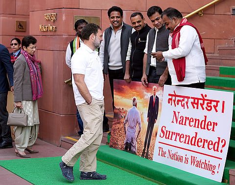 LoP in the Lok Sabha Rahul Gandhi, centre, arrives as Lok Sabha MPs who were suspended last week for the remainder of the Budget session for "unruly behaviour'', stage a protest at Parliament premises, in New Delhi.