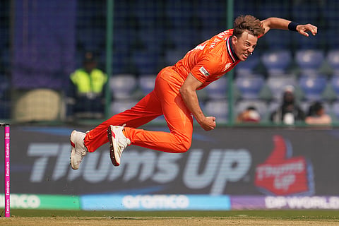 Netherlands' Max O'Dowd bowls a delivery during the T20 World Cup cricket match between Namibia and Netherlands in New Delhi.
