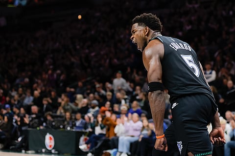 Minnesota Timberwolves guard Anthony Edwards (5) celebrates scoring during the first half of an NBA basketball game against the Los Angeles Clippers in Minneapolis.