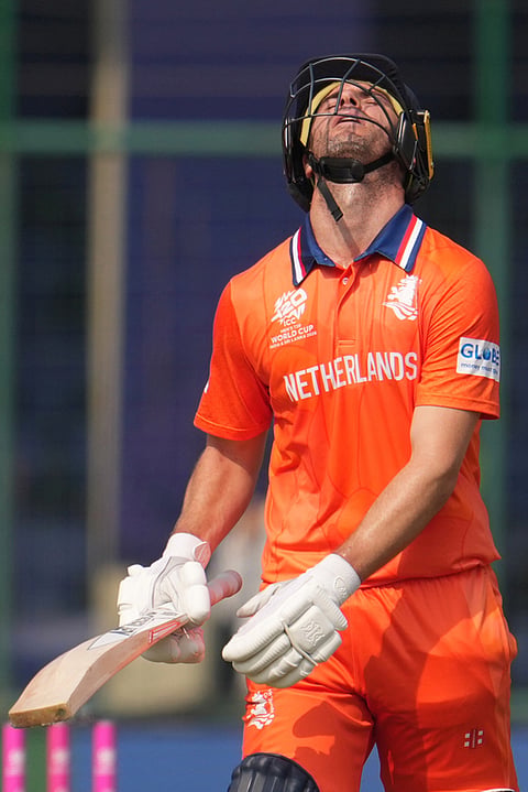 Netherlands' Colin Ackermann reacts and walks off the field after losing his wicket during the T20 World Cup cricket match between Namibia and Netherlands in New Delhi.