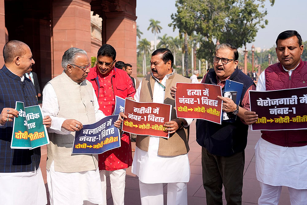| Photo: PTI/Ravi Choudhary : RJD MPs stage a protest in the Parliament premises over various issues during the Budget session, in New Delhi. 