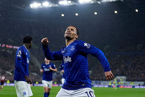 Everton's Iliman Ndiaye celebrates scoring their side's first goal of the game against Bournemouth during their English Premier League soccer match in Liverpool, England.