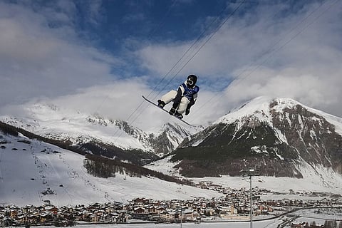 Japan's Ryusei Yamada practices during a snowboarding halfpipe training session at the 2026 Winter Olympics, in Livigno, Italy.