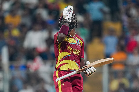 West Indies' Sherfane Rutherford celebrates his half century during an ICC Men's T20 World Cup 2026 cricket match between England and West Indies, at the Wankhede Stadium, in Mumbai, Maharashtra.