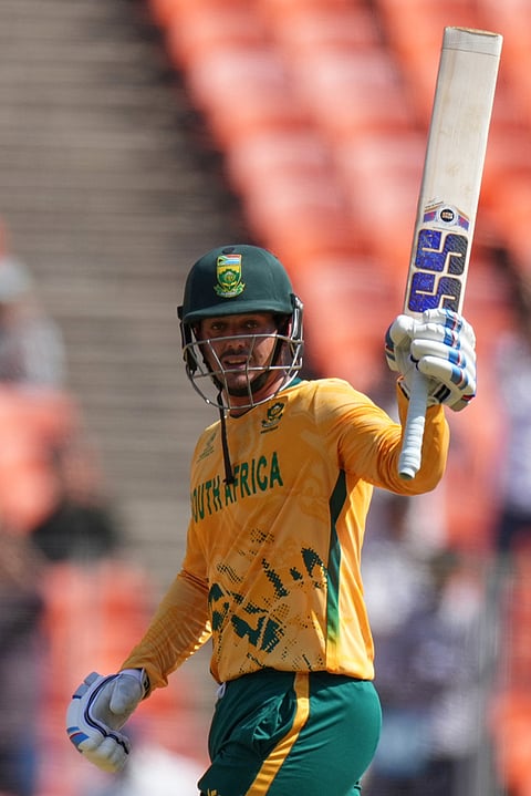 South Africa's Quinton de Kock celebrates after scoring fifty runs during the T20 World Cup cricket match between Afghanistan and South Africa in Ahmedabad.