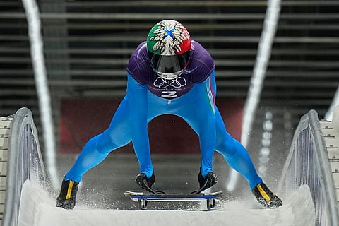 Italy's Amedeo Bagnis arrives at the finish during a men's skeleton training session at the 2026 Winter Olympics, in Cortina d'Ampezzo, Italy.