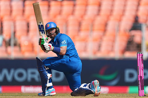 Afghanistan's Darwish Rasooli plays a shot during the T20 World Cup cricket match between Afghanistan and South Africa in Ahmedabad.