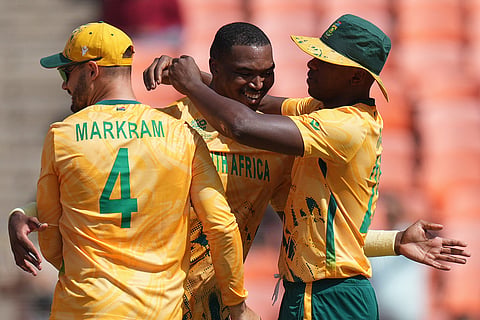 South Africa's Lungi Ngidi, centre, celebrates the dismissal of Afghanistan's Gulbadin Naib during the T20 World Cup cricket match between Afghanistan and South Africa in Ahmedabad.