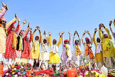 People perform rituals at the Sangam ahead of the 'Mahashivratri' festival, in Prayagraj, Uttar Pradesh.