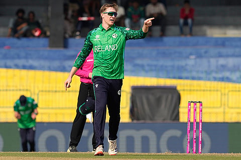 Ireland's Harry Tector reacts after taking the wicket of Australia's Glenn Maxwell during the T20 World Cup cricket match between Australia and Ireland in Colombo, Sri Lanka.