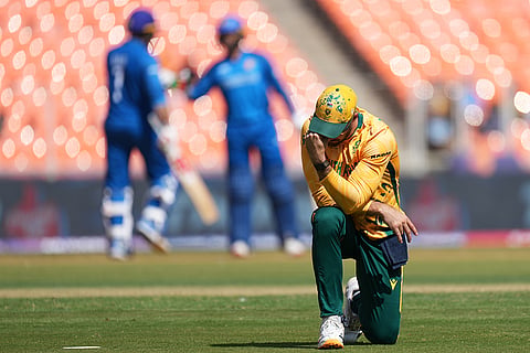 South Africa's captain Aiden Markram reacts after Afghanistan's Azmatullah Omarzai hits a boundary during the T20 World Cup cricket match between Afghanistan and South Africa in Ahmedabad.