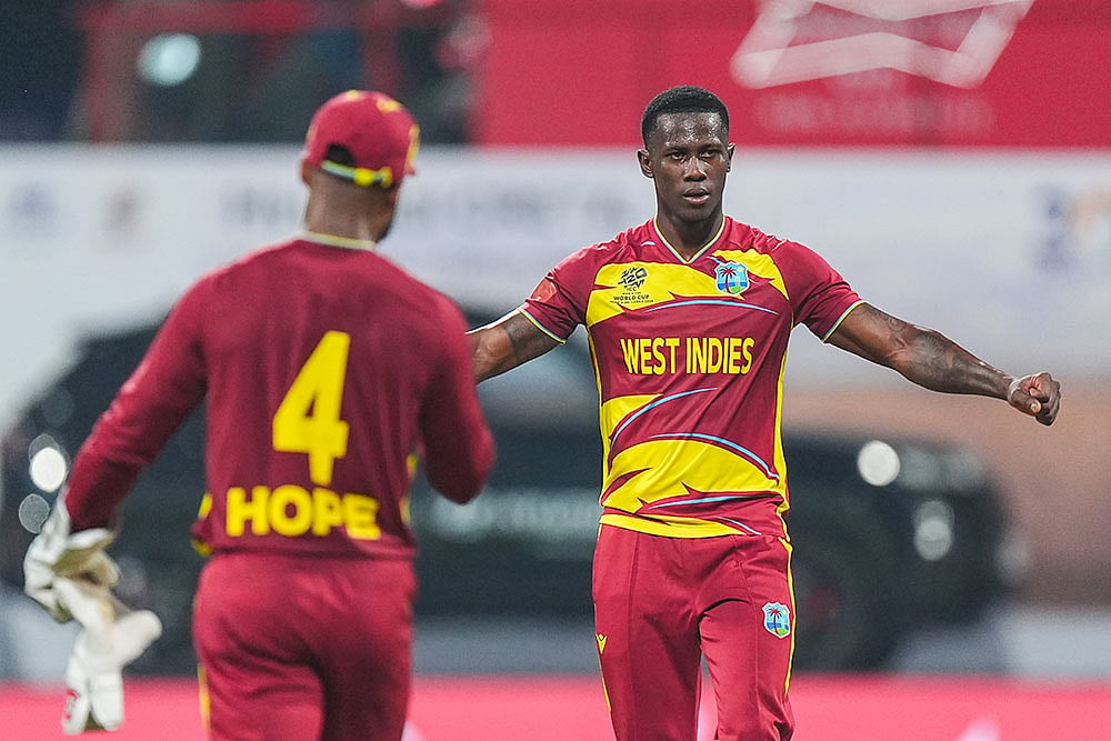 | Photo: PTI/Kunal Patil : West Indies' captain Shai Hope, left, and Shamar Joseph celebrate after winning an ICC Men's T20 World Cup 2026 cricket match between England and West Indies, at the Wankhede Stadium, in Mumbai, Maharashtra.