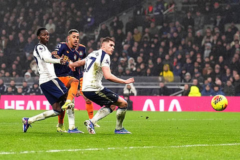 Newcastle United's Jacob Ramsey, second from left, scores their second goal against Tottenham during a Premier League soccer match London.
