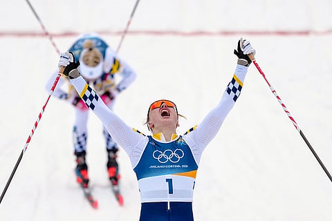Linn Svahn, of Sweden, crosses the finish line ahead of Jonna Sundling, also of Sweden, to win the gold medal in cross-country skiing women's sprint classic at the 2026 Winter Olympics, in Tesero, Italy.