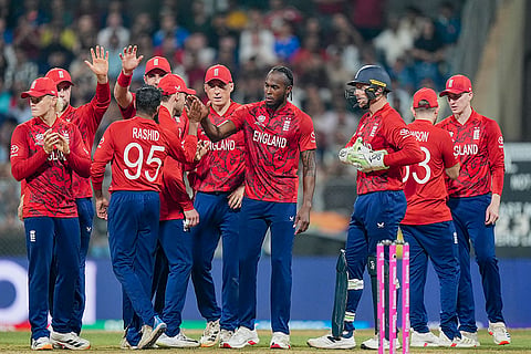 England's Adil Rashid celebrates with teammates after a DRS review for the wicket of West Indies' Roston Chase during an ICC Men's T20 World Cup 2026 cricket match between England and West Indies, at the Wankhede Stadium, in Mumbai, Maharashtra.