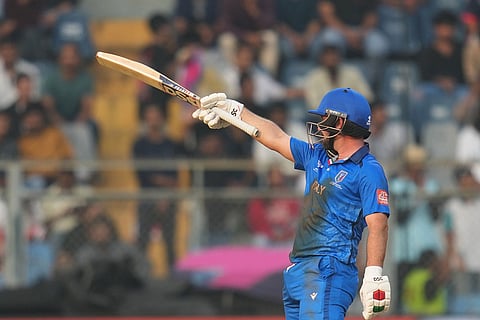 Italy's Anthony Mosca celebrates his fifty runs during the T20 World Cup cricket match between Italy and Nepal in Mumbai, India.