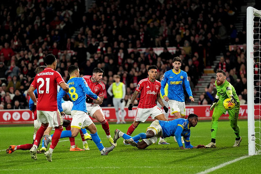 | Photo: Joe Giddens/PA via AP : Nottingham Forest's Morato, center, has a shot saved by Wolverhampton Wanderers goalkeeper Jose Sa, right, during the English Premier League soccer match between Nottingham Forest and Wolverhampton Wanderers, in Nottingham, England.