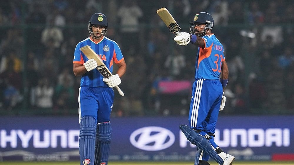 | Photo: AP/Manish Swarup : India's Shivam Dube applauds as batting partner Hardik Pandya celebrates his fifty runs during the T20 World Cup cricket match between India and Namibia in New Delhi.