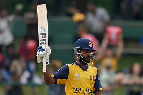 Sri Lanka's Pavan Rathnayake celebrates his fifty runs during the T20 World Cup cricket match between Oman and Sri Lanka in Pallekele, Sri Lanka.