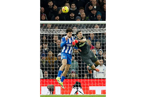 Aston Villa goalkeeper Emiliano Martinez clears the ball during their English Premier League soccer match against Brighton in Birmingham, England.