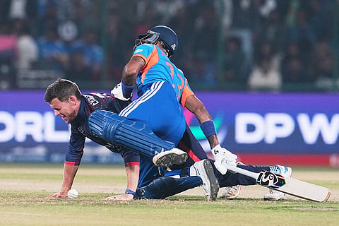Namibia's captain Gerhard Erasmus, left, and India's Hardik Pandya collide during the T20 World Cup cricket match between India and Namibia in New Delhi.