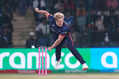 Namibia's Ruben Trumpelmann bowls a delivery during the T20 World Cup cricket match between India and Namibia in New Delhi.