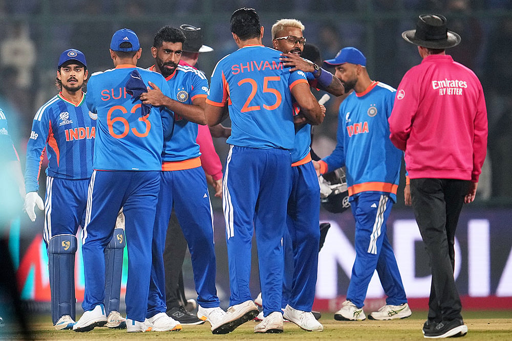 | Photo: AP/Manish Swarup : India's players celebrate after winning their T20 World Cup cricket match against Namibia in New Delhi.