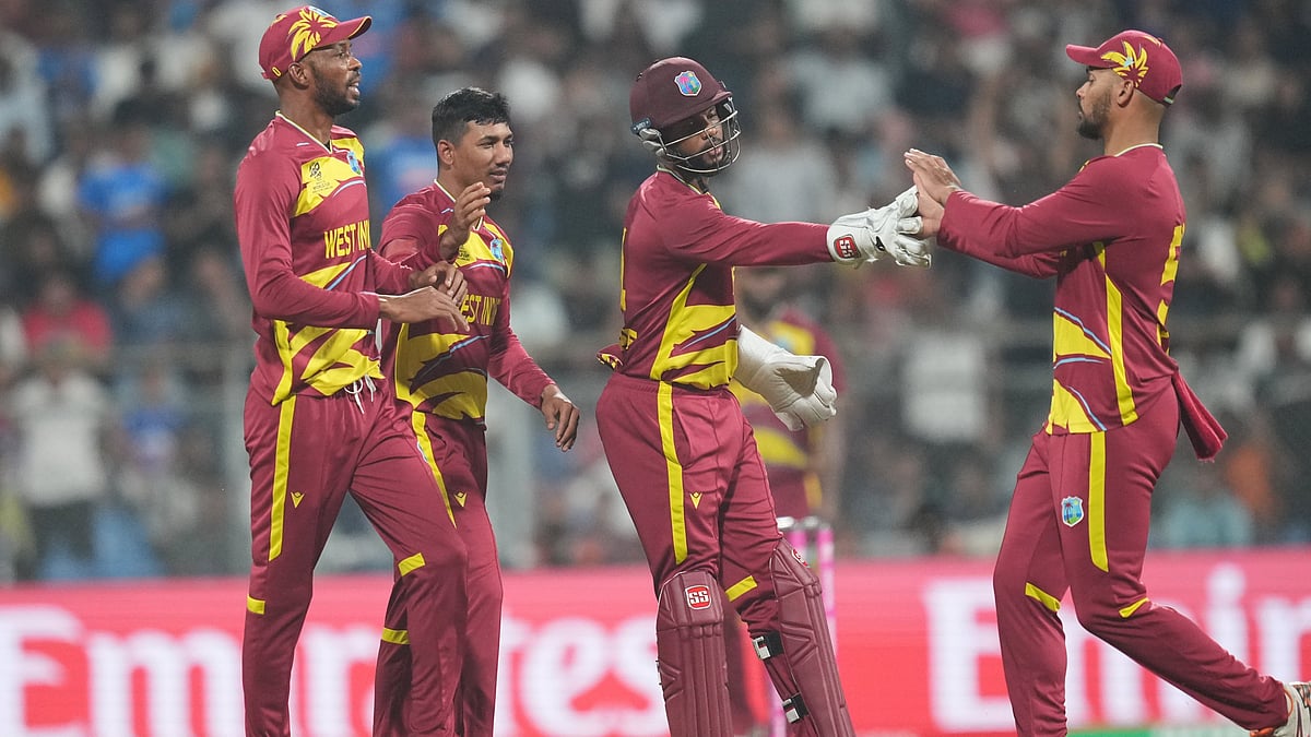 | Photo: AP/Rafiq Maqbool : West Indies' Gudakesh Motie, second from left, celebrates with teammates the wicket of England's Jacob Bethell during the T20 World Cup cricket match between England and West Indies in Mumbai, India, Wednesday, Feb. 11, 2026. 