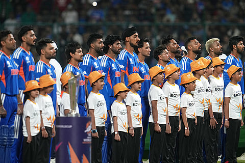 India's players stand up for the national anthems before the start of the T20 World Cup cricket match between India and Namibia in New Delhi.