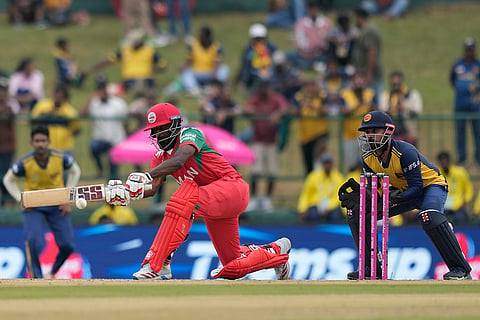 Oman's Mohammad Nadeem plays a shot during the T20 World Cup cricket match between Oman and Sri Lanka in Pallekele, Sri Lanka.