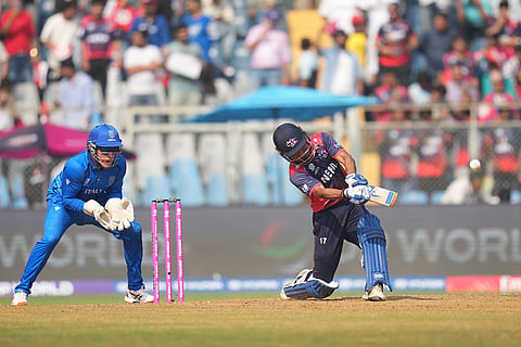 Nepal's captain Rohit Paudel plays a shot during the T20 World Cup cricket match between Italy and Nepal in Mumbai, India.