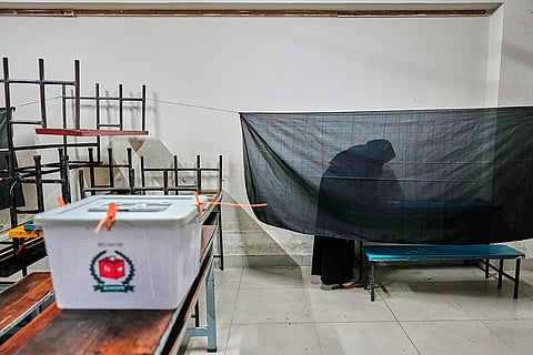 A Bangladeshi woman casts her vote in a polling station during national parliamentary election in Dhaka, Bangladesh, Thursday, Feb. 12, 2026. 