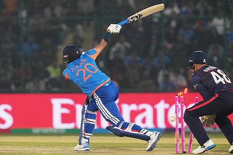 India's Axar Patel is bowled out by Namibia's captain Gerhard Erasmus during the T20 World Cup cricket match between India and Namibia in New Delhi.