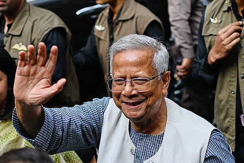 Chief Adviser of Bangladesh Muhammad Yunus waves after casting his vote as he comes out of a polling center during the national parliamentary elections in Dhaka, Bangladesh, Thursday, Feb. 12, 2026. 