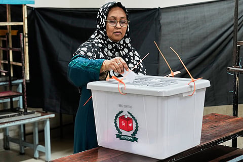A woman casts her vote at a polling station during the national parliamentary election in Dhaka, Bangladesh, Thursday, Feb. 12, 2026. 