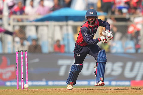 Nepal's Aarif Sheikh plays a shot during the T20 World Cup cricket match between Italy and Nepal in Mumbai, India.