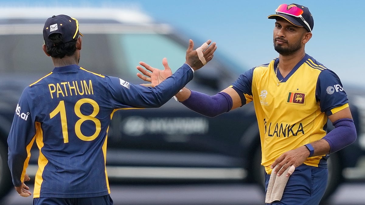| Photo: AP/Eranga Jayawardena : Sri Lanka's captain Dasun Shanaka, right, and Pathum Nissanka celebrates after Sri Lanka won the T20 World Cup cricket match against Oman in Pallekele, Sri Lanka, Thursday, Feb. 12, 2026.