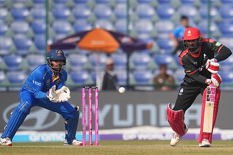 Canada's Navneet Dhaliwal plays a shot during the T20 World Cup cricket match between Canada and United Arab Emirates in New Delhi.