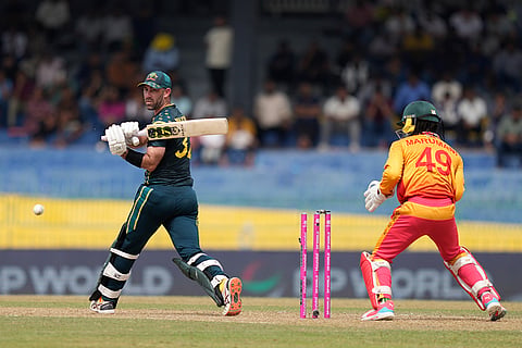 Australia's Glenn Maxwell bowled out by Zimbabwe's Ryan Burl during the T20 World Cup cricket match between Australia and Zimbabwe in Colombo, Sri Lanka.
